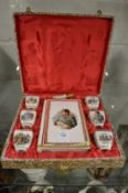 A limoge porcelain boxed Napoleon liquor set.