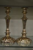 A pair of Sheffield plate candlesticks.
