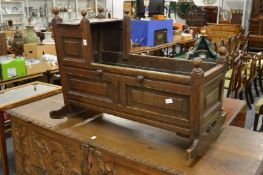 An 18th century oak cradle.