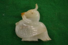 A carved jade duck.