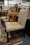 A pair of George III style mahogany framed side chairs with later leather cloth upholstery.