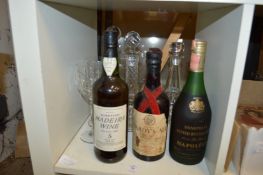 Decanters, glassware and three bottles of spirits and ale.