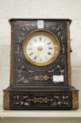 A decorative mantel clock.