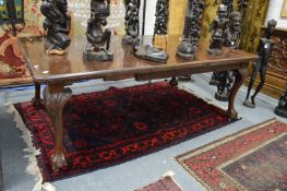 An Edwardian mahogany extending dining table.