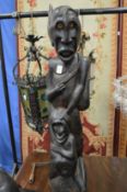 An unusual African carved hardwood figure group.
