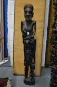 A large African carved hardwood figure group.