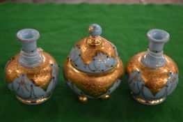 A gilt decorated turquoise glass garniture.