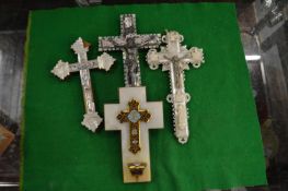 Four mother-of-pearl and other crucifixes.