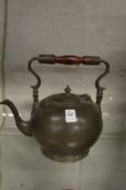 A pewter teapot.