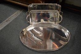 A plated oval twin handled galleried tray and two others.