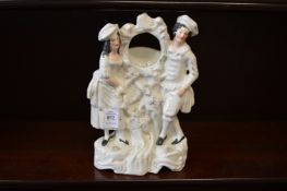 A Staffordshire watch holder.