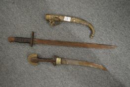 An Eastern dagger and a bayonet.