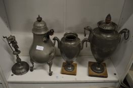 Various pewter urns and other items.