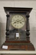 A mantel clock.