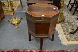 A George III mahogany and brass bound octagonal shaped cellarette.