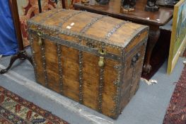 A good dome topped travelling trunk circa 1900 by Parisian Malletier with strapwork decorated