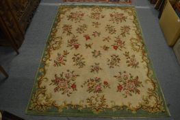 A French woolwork carpet with floral decoration. 200cm x 140cm.