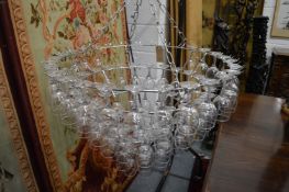 A highly unusual chrome wirework ceiling shade, the five tiers formed from inverted wine glasses (