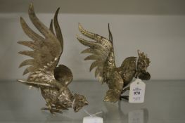 A pair of plated fighting cockerels.