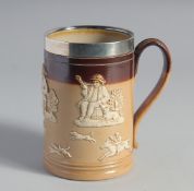 A ROYAL DOULTON STONEWARE TANKARD with silver rim. Sheffield, 5ins high.