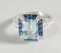 AN 18CT GOLD, AQUAMARINE, SAPPHIRE AND DIAMOND RING.