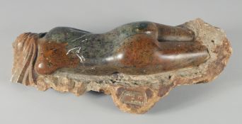 CARLOS de ALMEIDA, No. 90. A MARBLE NUDE TORSO on a rocky base carved from the solid. 18ins long.