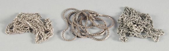 THREE SILVER NECKLACES.
