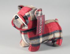A SCOTTIE DOG CLOTH DOORSTOP.