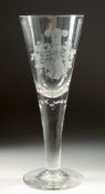 A GOOD TALL TAPERING GLASS engraved with a crest. 11ins high.