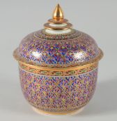A GOOD ISLAMIC DESIGN CIRCULAR BOWL AND COVER on a blue ground. 6ins high.