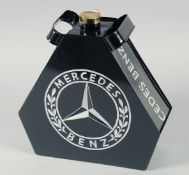 A REPLICA BLACK MERCEDES BENZ OIL CAN.