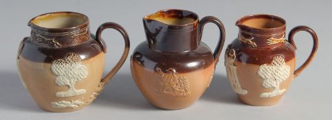 THREE VARIOUS ROYAL DOULTON STONEWARE JUGS. 3- 7ins high.