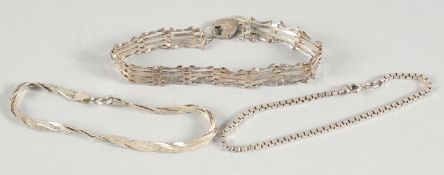 THREE SILVER BRACELETS.