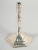 A STERLING SILVER TAPER STICK, CRIGHTON & CO., New York. 4.5ins high.