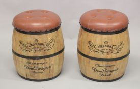 A PAIR OF CHAMPAGNE BARREL SEATS with studded leather seats.