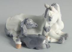 A COPENHAGEN PORCELAIN HORSE AND FOAL. No. 4698, 6.5ins high.