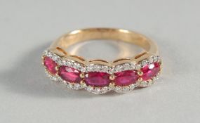 AN 18CT YELLOW GOLD, RUBY AND DIAMOND HALF HOOP RING.