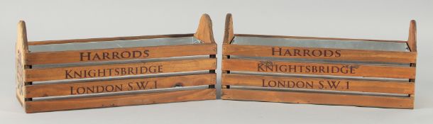 A SMALL PAIR OF HARRODS WOODEN PLANTERS WITH TIN LINERS 14ins long.