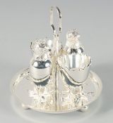 A FOUR PIECE SILVER PLATED CHICK CRUET on a circular base. 4.5ins high.