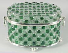 A LARGE GREEN GLASS AND PLAIN GLASS OVAL CASKET with silver plated handles and mounts. 14ins wide,