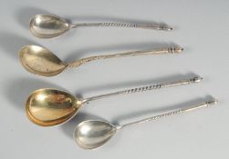 A PAIR OF RUSSIAN SILVER NIELLO SPOONS, 5.5ins long and two larger spoons, 6.5ins long (4).