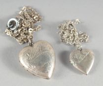 TWO SILVER LOCKETS AND CHAINS.