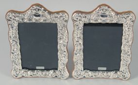 A PAIR OF SILVER FRAMED UPRIGHT PHOTOGRAPH FRAMES 7.5ins x 6.5ins.
