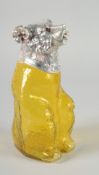 A LARGE YELLOW GLASS AND SILVER PLATED BEAR CLARET JUG with glass eyes. 9ins high.