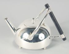 A SMALL CHRISTOPHER DRESSER DESIGN SILVER PLATED CIRCULAR TEA POT. 5ins diameter.