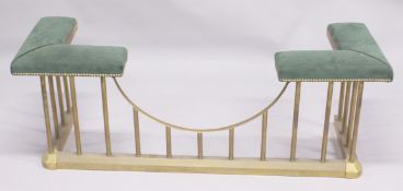 A BRASS CLUB FENDER with padded top.