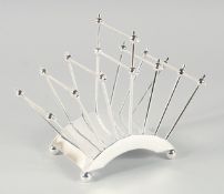 A CHRISTOPHER DRESSER DESIGN SIX DIVISION PLATED TOAST RACK. 8ins long.