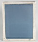 A LARGE SILVER UPRIGHT PHOTOGRAPH FRAME. 11ins x 9ins.
