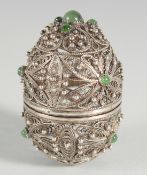 A PIERCED SILVER EGG.