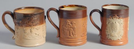 THREE VARIOUS ROYAL DOULTON STONEWARE MUGS. 3.5ins high.